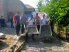 Bhabinkamtibmas Polsek Muara Kuang Hadiri TRIAL Pembangunan Jalan Rabat Beton di Desa Munggu